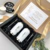 kit de regalo para padrinos con una caja color negro y mensaje personalizado para peticion de padrinos de xv y como contenido dos termos color blanco con grabado laser personalizado con nombres