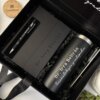 Set de regalo personalizado: caja negra con un termo delgado de 590 ml, un cuaderno magnético vertical y un bolígrafo, todo ello con la etiqueta Dra. Irra Beltrán; tapa de madera incluida. Un kit perfecto regalo personalizado.
